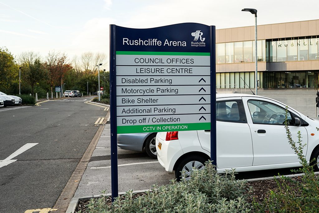 Post mounted wayfinding sign showing drivers where to go around the site.