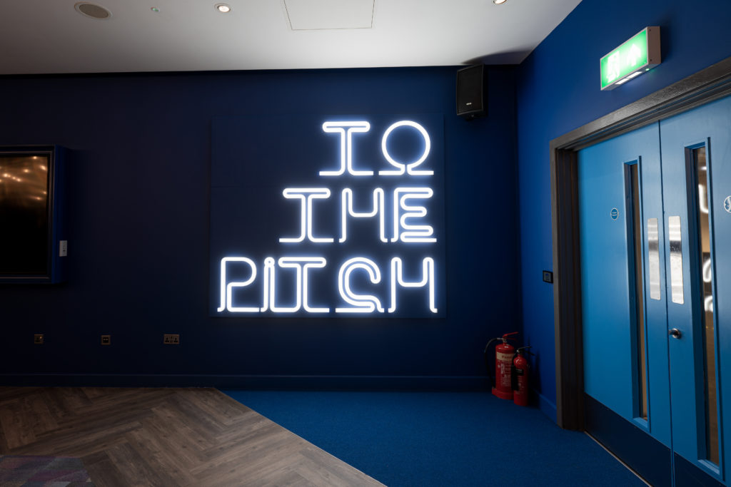 Illuminated flexible LED sign within the Coventry Lounge at The Coventry Building Society Arena.